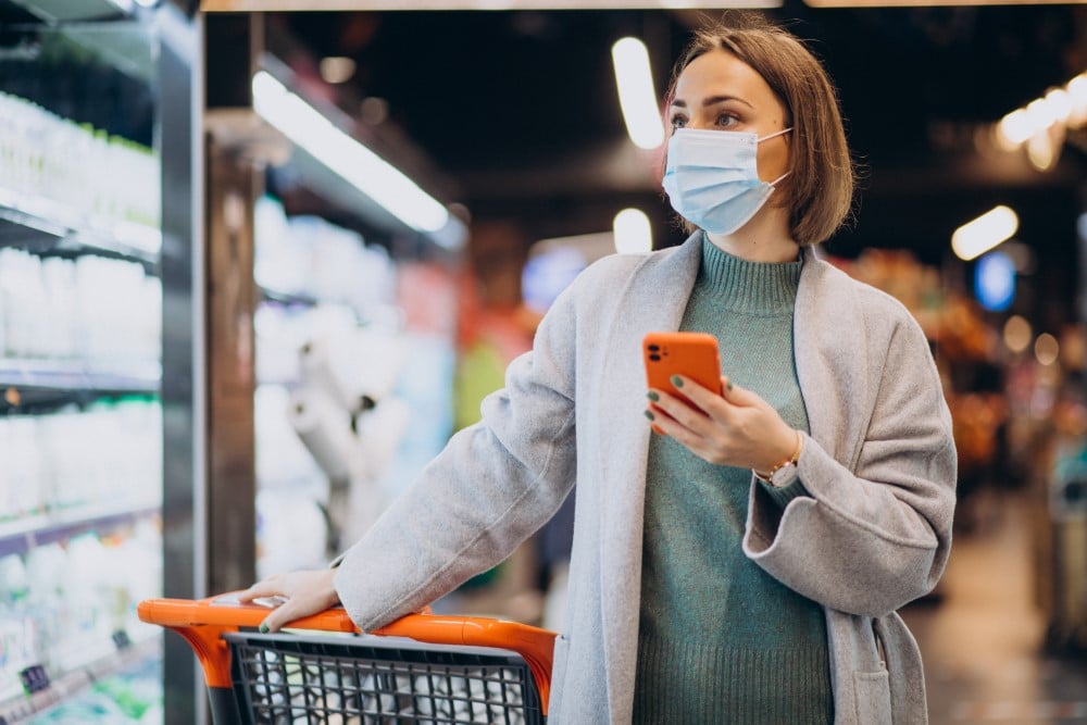 woman wearing face mask shopping grocery store