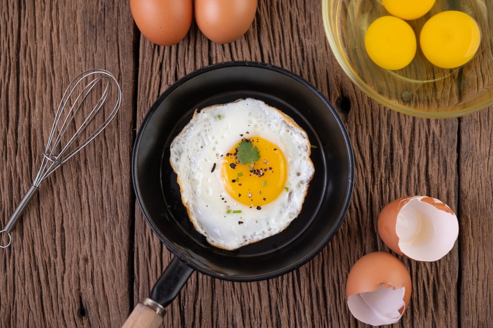 fried eggs frying pan raw eggs organic food good health high protein