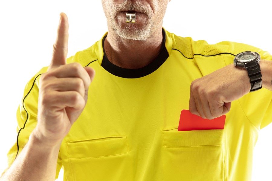 referee showing red card displeased football soccer player