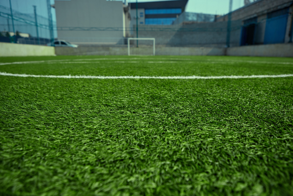 empty football field green grass