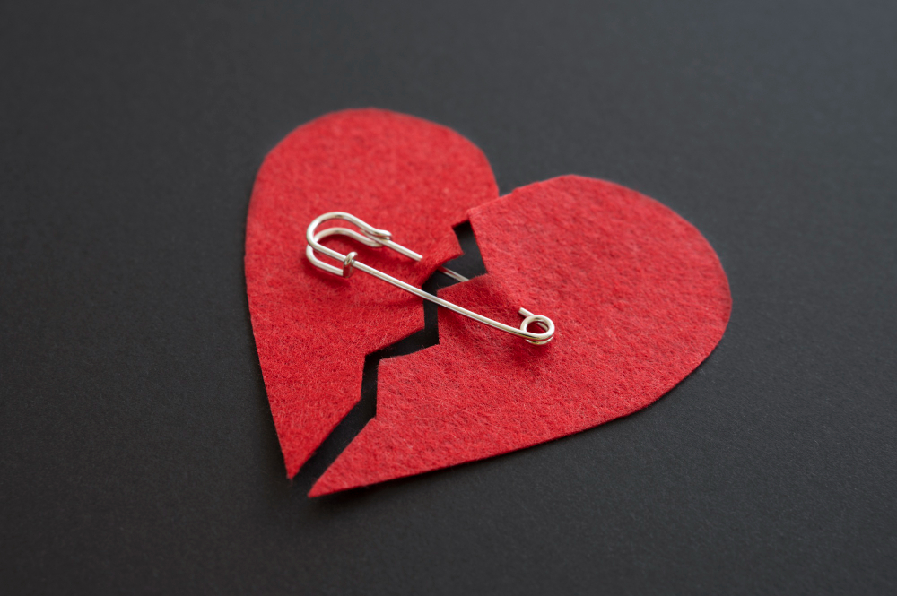 high angle broken heart with safety pin