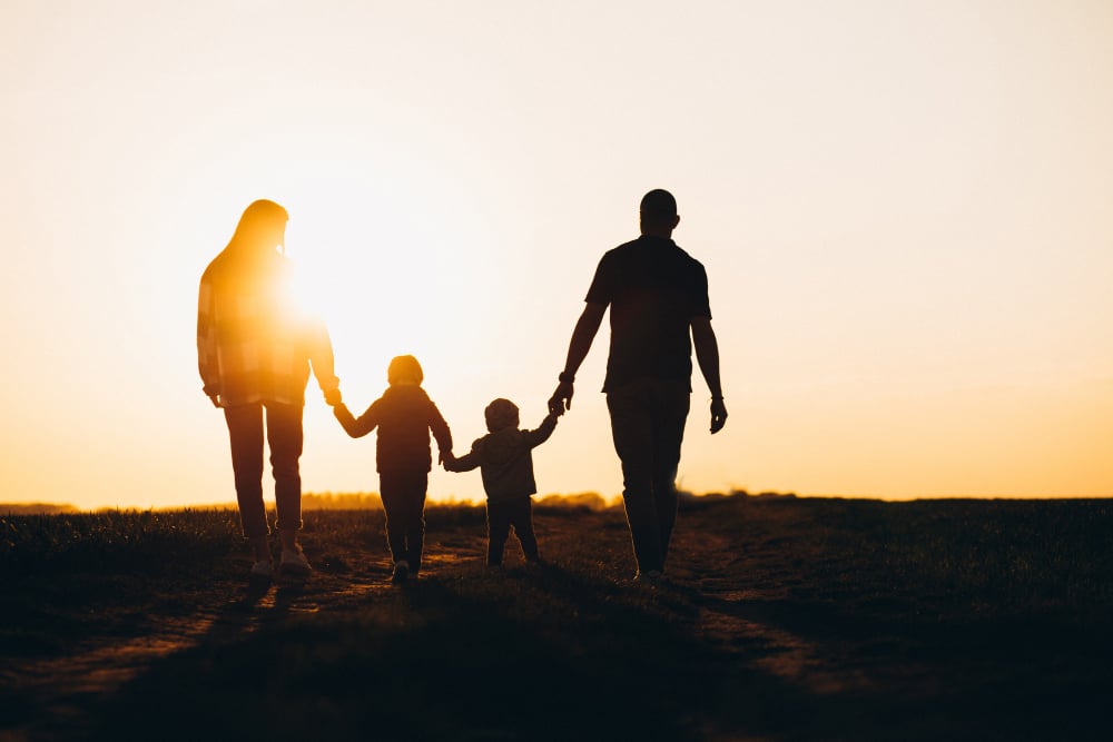 happy family silhouette sunset