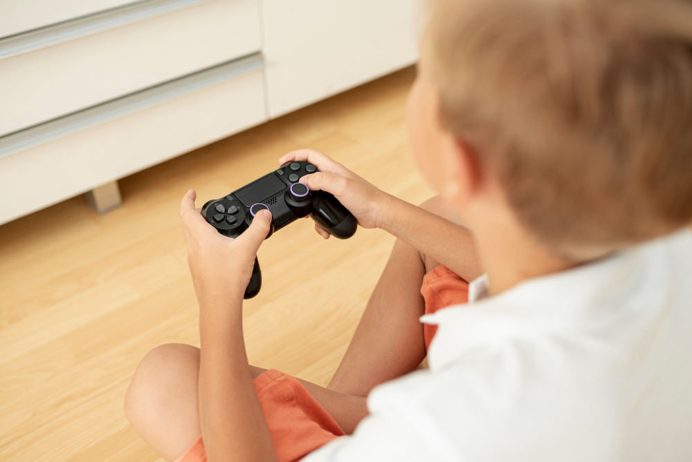 close up child holding controller